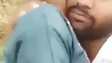 Indian outdoor sex of a guy sucking his GF’s tight boobs